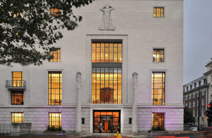 Exterior view of RIBA building, a grand neoclassical structure with columns and a large pediment.