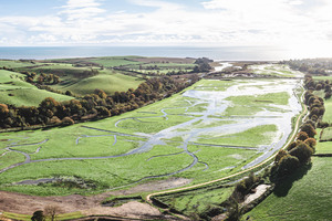 Aerial view of the Lower Otter land area, green and riddled with watercourses