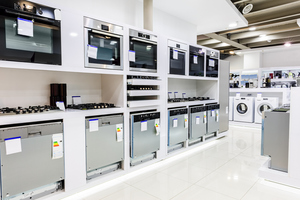 Gas and electric ovens and other home-related appliancs  in a retail store showroom