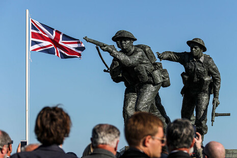 A statue showing Armed Forces personnel at the British Normandy Memorial.
