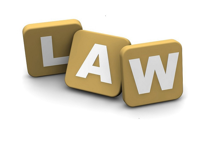 3 individual wooden tiles with letters spelling the word 'LAW'