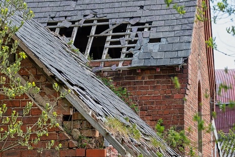 the roof of a derelict house