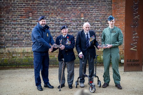 D-Day veterans Stan Ford and John Roberts are presented with plaques bearing their names