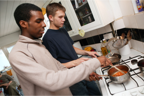 Two young people cooking