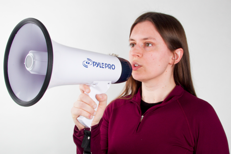 A woman making an announcement, image provided by Tim Reckmann on Flickr’