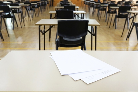 Tables and exam papers in an exam hall