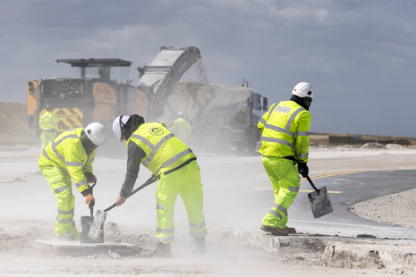 Workers taking part in the resurfacing of the alpha loop. MOD Crown Copyright – Cpl Laura Wing.