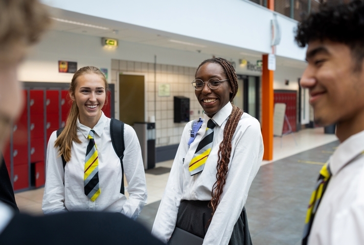 A group of male and female stuidents in school uniform