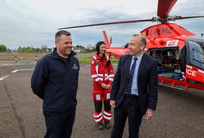 The NI Secretary of State with members from the Air Ambulance Northern Ireland team
