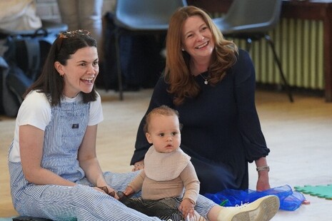 Gillian Keegan with a toddler at a nursery