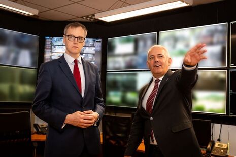 The Minister for Countering Illegal Migration, Michael Tomlinson, is shown surveillance monitors in Albania.