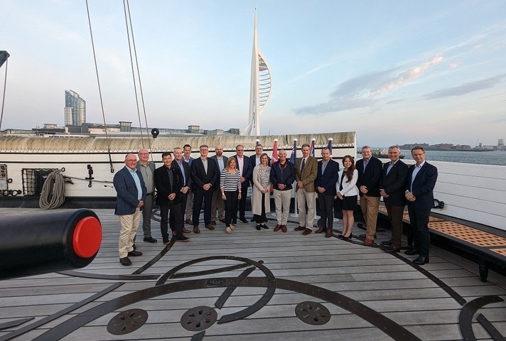 Members of the Five Eyes Combined Digital Leadership Forum on HMS Warrior in Portsmouth