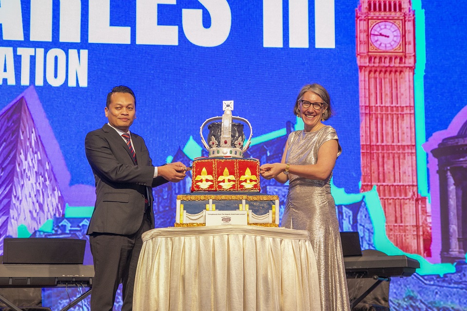 British High Commissioner to Malaysia Ailsa Terry cutting His Majesty King Charles III’s 76th birthday cake with Guest of Honour YB Nik Nazmi Nik Ahmad, Minister of Natural Resources and Environmental Sustainabi - Copy