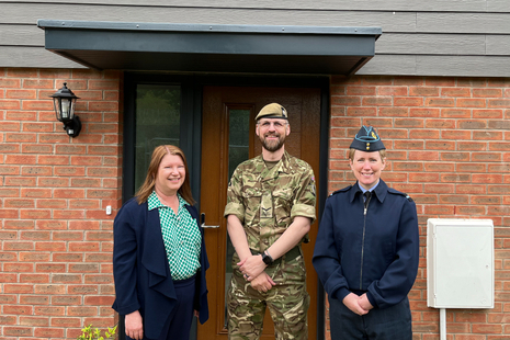 Lance Corporal Peter Mitchell receives the keys to his new home from DIO Head of Accommodation, Air Commodore Leah Griffin (right) and DEO Army Programme Director, Belinda Lunn (left). MOD Crown Copyright.