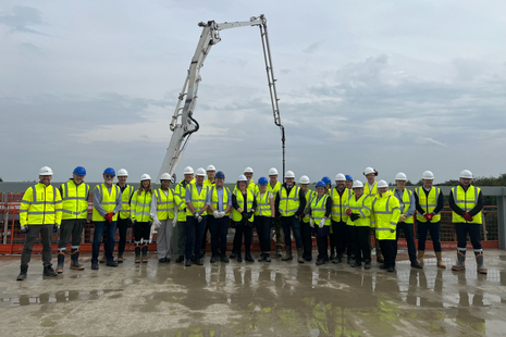 Representatives from the MOD, NHS, Tilbury Douglas and Aecom at the topping out ceremony. MOD Crown Copyright.