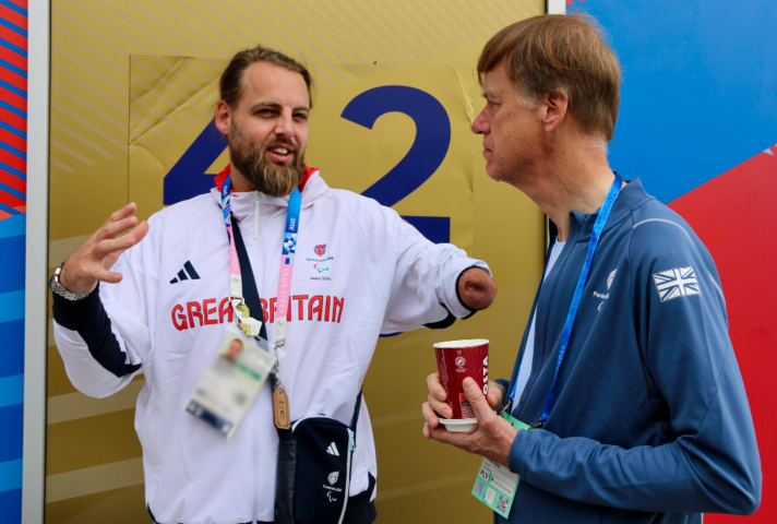 The Minister for Social Security and Disability, Sir Stephen Timms MP, speaking with gold medal Para taekwondo athlete, Matt Bush.