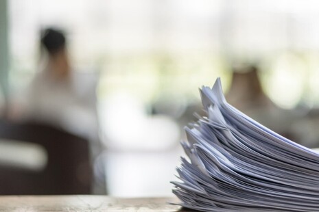 A stack of test papers on a table