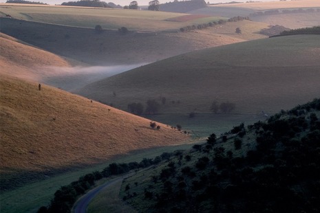 A photograph of the Yorkshire Moors with mist lying in the valleys