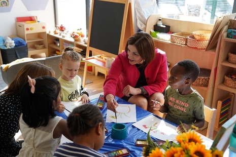 Education Secretary with young children at a nursery