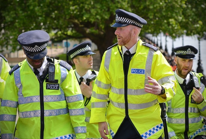 Group of police officers wearing high-vis jackets. Credit: Shutterstock.