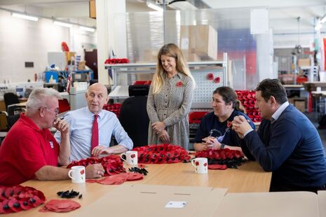 Defence Secretary John Healey with veterans at the Poppy Factory