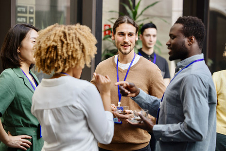 A group of men and women talking