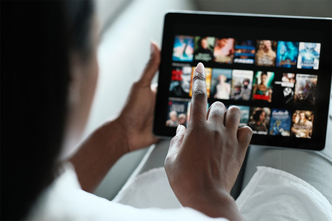 Lady watching programmes on an ipad