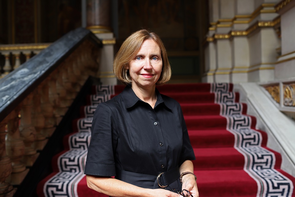 Sally Langrish stood in front of a staircase