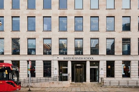 Exterior of a building in light-coloured stone with darkened rectangular windows on each floor.  Credit: Bayes Business School