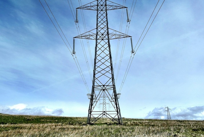 Power lines on pylons. Credit: Unsplash