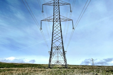 Power lines on pylons. Credit: Unsplash