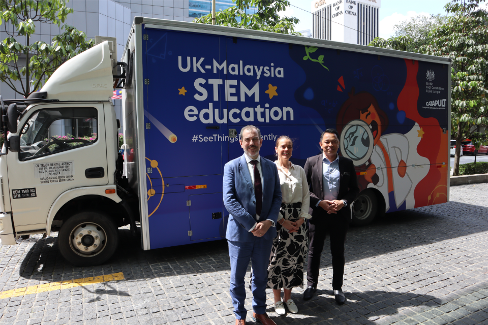 Acting British High Commissioner, David Wallace, Dep DG of Education, School Operational Sector, Ministry of Education, Zainal bin Abas and Skills Academy Manager, CSA Catapult, Alexandra Leadley in front of the STEM mobile lab