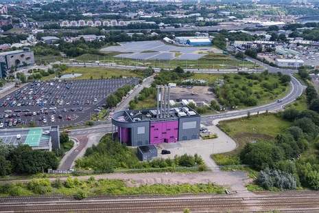 Aerial photo showing skyline of gateshead with a car park and the Gateshead Energy Company in front, a large ruple building with chimneys