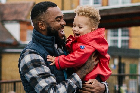 dad with 3 year old in nursery playground