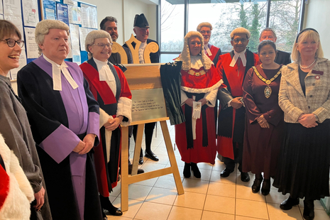 HMCTS staff and members of the judiciary gather to open a new courtroom at Redditch Magistrates' Court