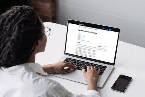 Woman at laptop submitting a planning appeal