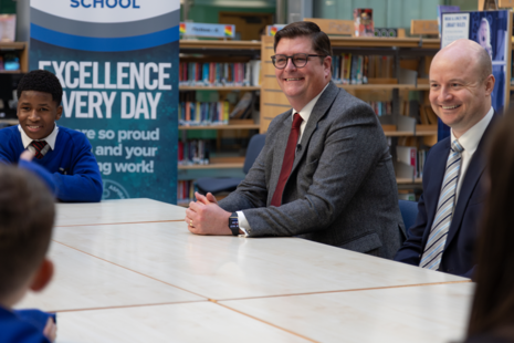 Sir Martyn Oliver at a high school with pupils