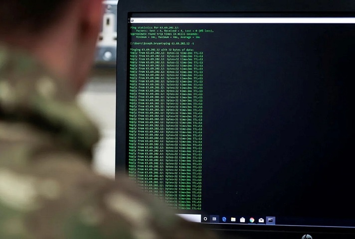 Soldier looking at a computer screen