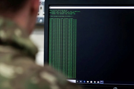 Soldier looking at a computer screen