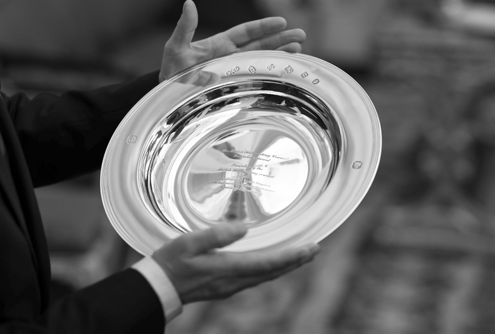 Touchstone award engraved on a silver plate.