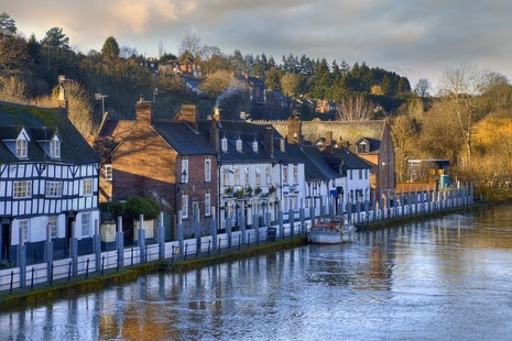 Flood defences outside houses along the River Severn.