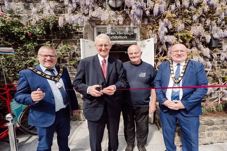 Secretary of State with the Mayor of Antrim and Newtownabbey, Councillor Neil Kelly, Deputy Mayor Councillor Paul Dunlop BEM, and World War II expert and tour guide Mike Gilmore.