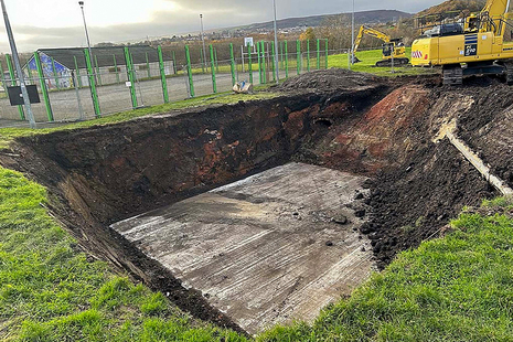 Investigating the existing mine shaft cap.