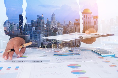 Businessman Examines Finance Tax