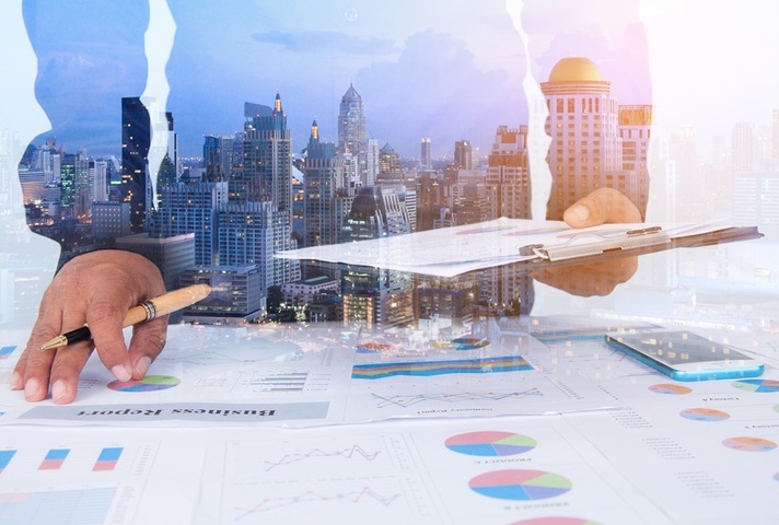 Businessman Examines Finance Tax