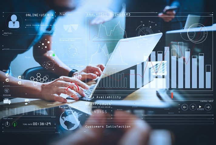 Person typing at laptop, overlaid by images of graphs. Credit: Shutterstock