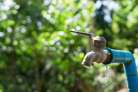 Water leaks out of a garden tap