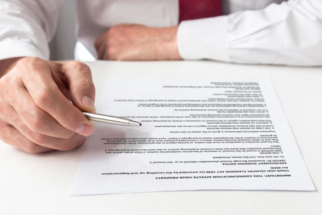 Person reading an enforcement notice