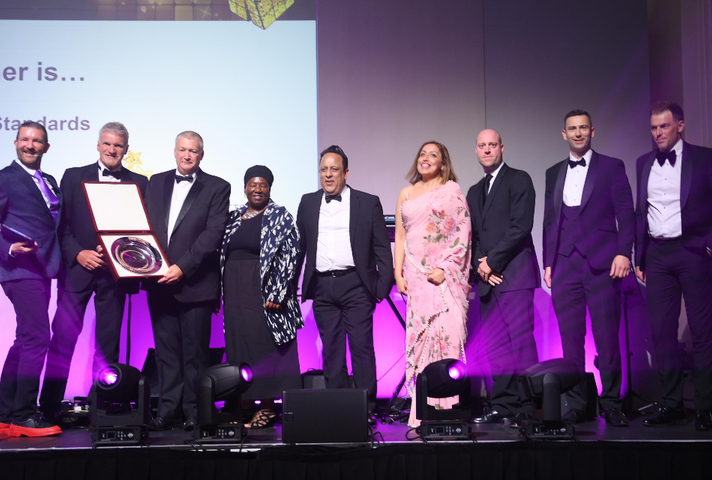 Touchstone award winners collect their award on stage.