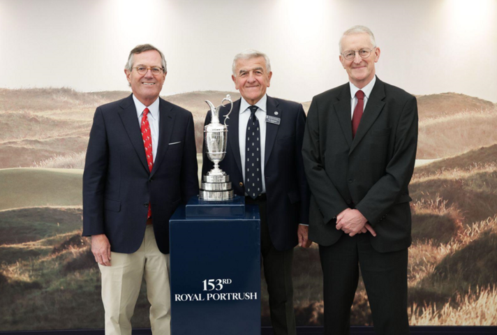 Caption: Secretary of State Hilary Benn with The Claret Jug trophy and (L-R) United States Ambassador to the UK Warren A. Stephens and Captain of The Royal and Ancient Golf Club of St Andrews, Ian Pattinson.